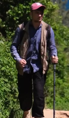A Hiker using the Trek Staff Walking Hiking Stick